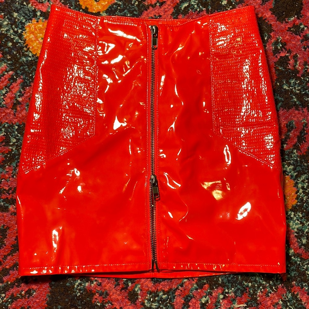 Red zip up “plastic” material skirt